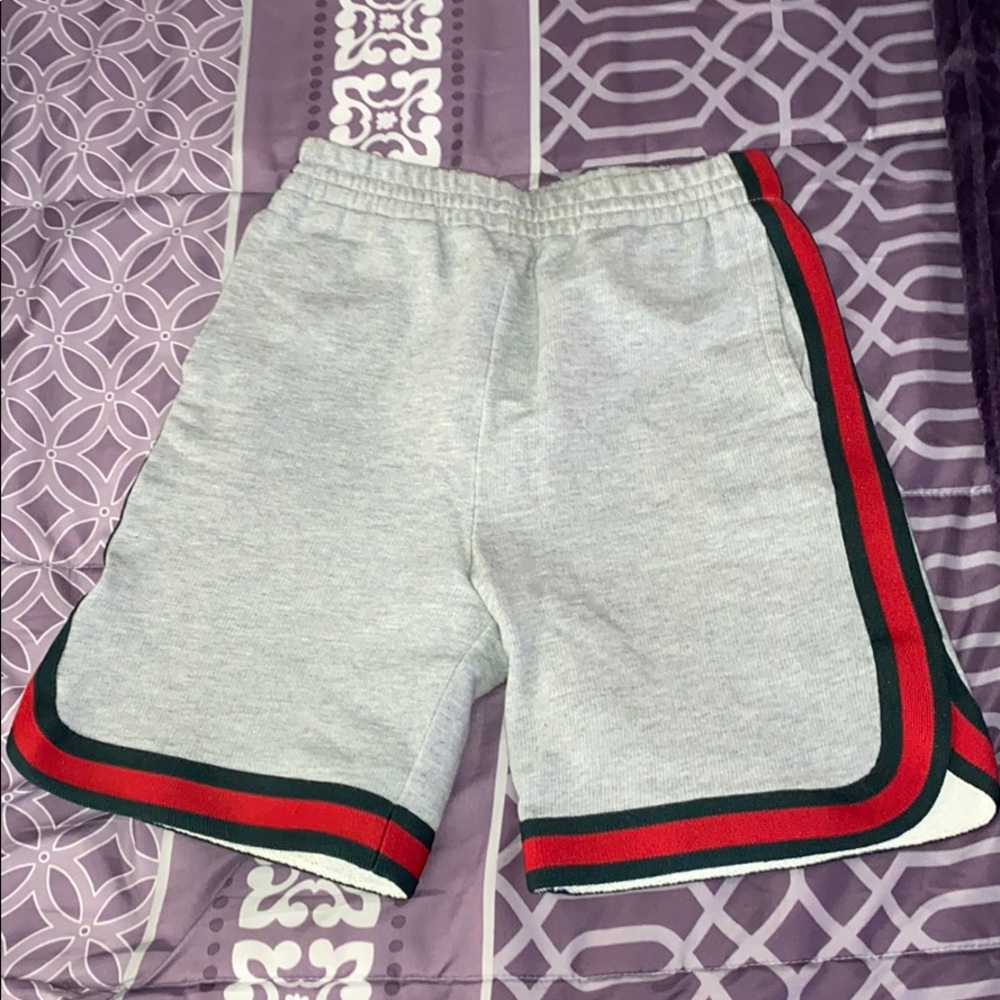 Authentic Gucci sweat shorts green and red trim.